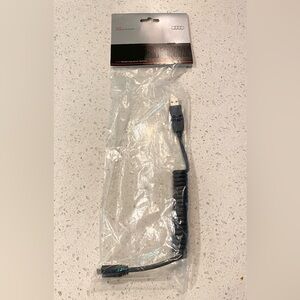 Audi original cell phone charger cord NWT. Never used this one. USB to micro USB
